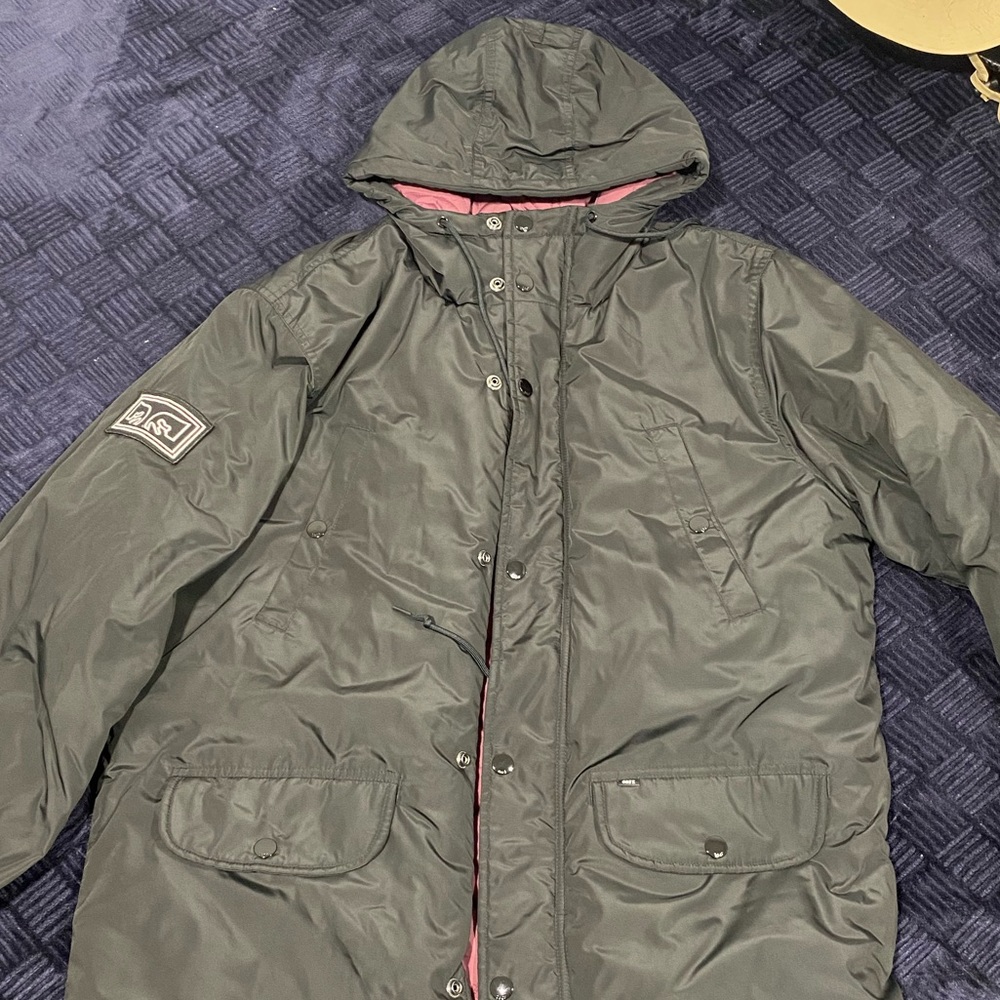 Large Black Obey Parka Jacket. 100% polyester, 4 exterior, 1 interior pockets.